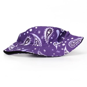 Detailed view of the purple paisley bucket hat fabric with star and moon digital prints