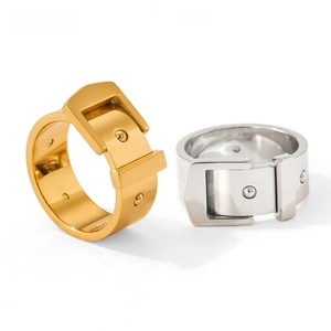 Detailed close-up of belt buckle style stainless steel rings in gold and silver finish
