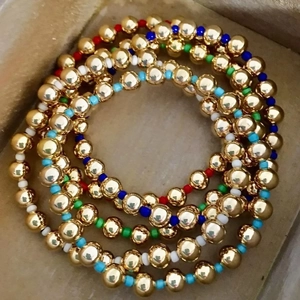 Five-layer bohemian elastic bracelet set with 18K gold beads and colorful seed accents