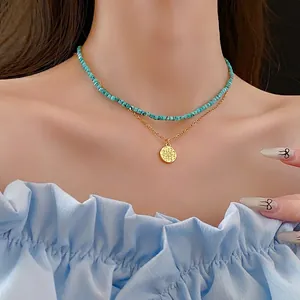 Double-layer beaded necklace with sky blue turquoise stones and a gold star pendant