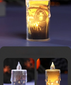 Detail of Halloween LED candle light featuring grim reaper and pumpkin patterns with dripping wax