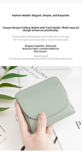 Detail view of mint green leather wallet featuring litchi texture and curved flap cover