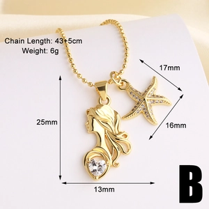 Detailed view of gold mermaid and starfish charms with heart zircon on a beaded chain