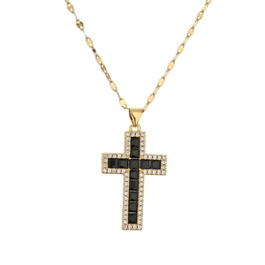 Gold cross necklace with central black square gemstone and small transparent stones