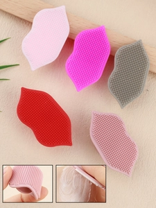 Detail of soft silicone lip-shaped cleansing brushes showing flexibility and foam lather