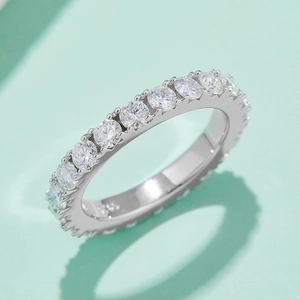 Elegant S925 sterling silver eternity ring featuring brilliant round moissanite stones