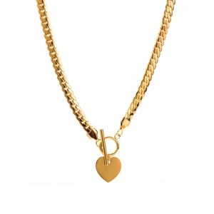 Golden cuban chain necklace featuring a heart pendant and classic OT toggle clasp detail
