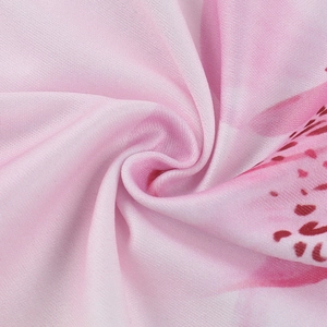 Detailed close-up of pink floral print fabric texture and soft chiffon material