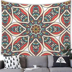 Bohemian mandala tapestry with geometric patterns hanging above a sofa for home decor