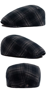 Detail view of vintage plaid flat cap with navy checkered wool fabric and metal side buckle