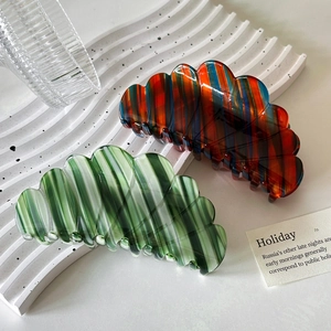 Set of two wavy acetate shell hair claws with colorful stripes for elegant styling