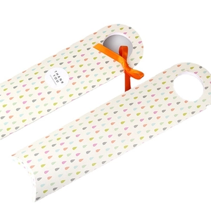 Minimalist long rectangular cookie boxes with colorful raindrops and orange ribbon