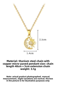 Macro shot of gold sun and moon pendant with micro-pave crystals on titanium steel chain