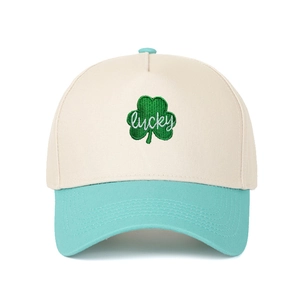 Detail of leaf embroidery and lucky text on a two-tone mesh trucker baseball cap
