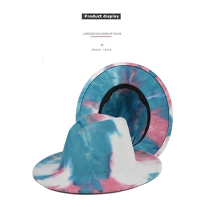 Detail of blue and pink tie-dye fedora hat showing wide brim and black sweatband