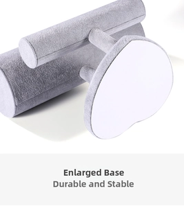 Detail view of grey velvet jewelry display stand featuring a stable enlarged base design