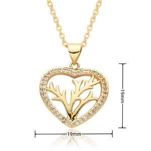 Detailed view of an 18k gold plated heart pendant with zircon and natural textures