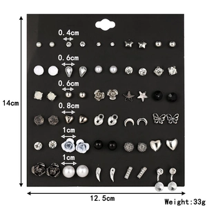 Detail of 30-pair stud earring set with dimensions and weight on display card