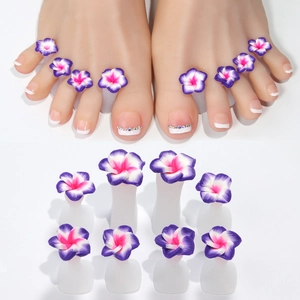 Macro detail of 8-piece purple frangipani silicone toe separators for professional pedicures