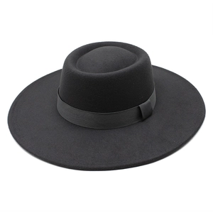 Detail view of the black wool felt wide brim fedora hat with matching grosgrain ribbon