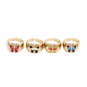 Set of four gold butterfly rings with colorful enamel wings in red black yellow and blue