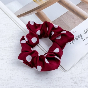 Deep red satin scrunchie with white polka dots for stylish hair styling accessories