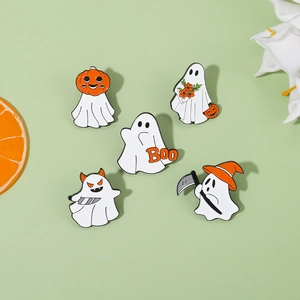 Macro detail of five ghost enamel pins with pumpkin and witch hat Halloween designs