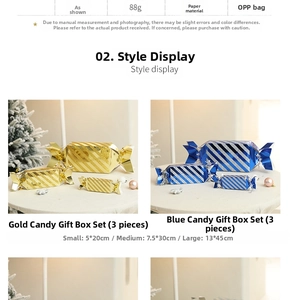 Detailed view of candy-shaped Christmas gift boxes in glossy gold and blue striped finish