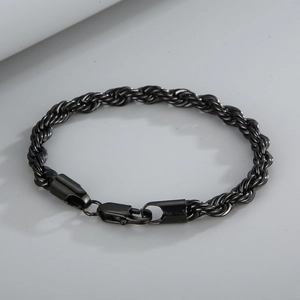 Close-up of minimalist black titanium rope chain bracelet with secure lobster clasp