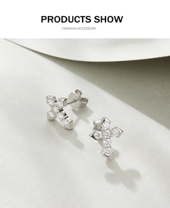 Detail view of S925 sterling silver cross stud earrings with clear sparkling zircon stones