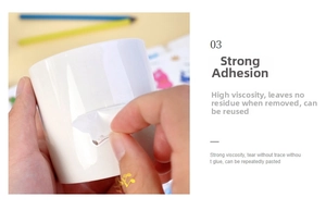 Detail of strong adhesive waterproof stickers being peeled off a white ceramic mug
