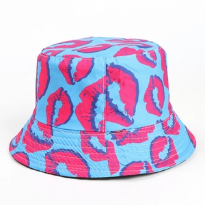 Detailed close-up of light blue sun bucket hat with pink lip print and reinforced stitching