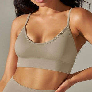 Close-up of seamless knit yoga bra with ribbed wide underband and thin straps in beige