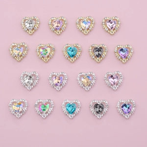 Assorted heart nail charms with crystal gemstones and glitter borders in gold and silver