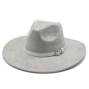 Close-up of light grey suede jazz hat with white leather band and silver metal buckle