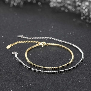 Macro detail of double-layer tennis bracelet with black cubic zirconia and lobster clasp