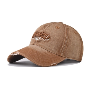 Detailed side view of washed brown denim baseball cap with London ONLY embroidery