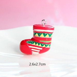 Detailed view of a red resin Christmas boot pendant with green accents and 2.6x2.7cm size