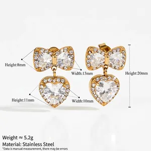 Golden stainless steel bow and heart earrings set with sparkling zircon accents