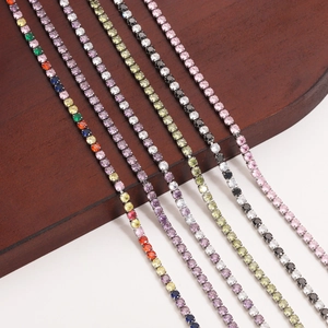 Macro view of multi-color tennis chains with zircon stones on a wooden display