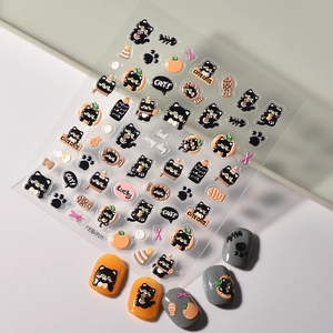 Detail of embossed black cat nail stickers with cute fish and paw patterns for DIY manicure