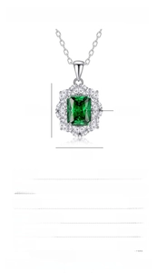 Macro detail of S925 silver necklace with 2.5ct emerald cut green gemstone and pavé stones
