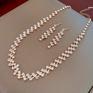 Macro detail of luxury geometric square rhinestone necklace and matching earring set