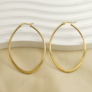 Detailed macro view of 18K gold-plated oval hoop earrings with shiny metallic finish