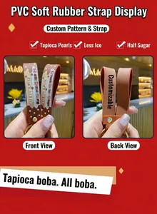 Detailed view of the brown PVC wrist strap featuring the Bear's milk tea text and icons