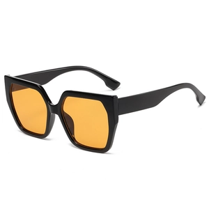 Fashionable oversized square sunglasses with black thick frames and orange tinted lenses