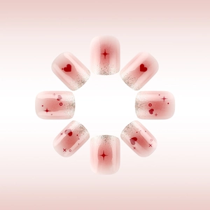 Pink gradient press-on nails with silver glitter, red hearts and star patterns