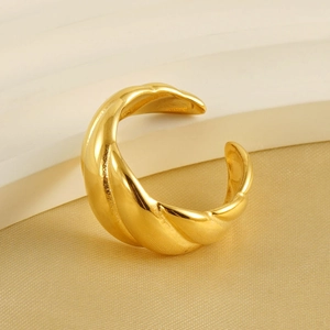 Polished 18k gold croissant ring with an adjustable open design and twisted texture