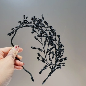 Elegant black beaded crystal headband featuring hand-woven branch-like floral patterns