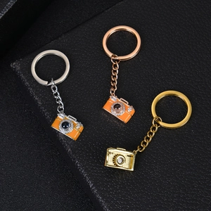 Custom photo camera keychains in silver, rose gold, and gold finish with crystal accents